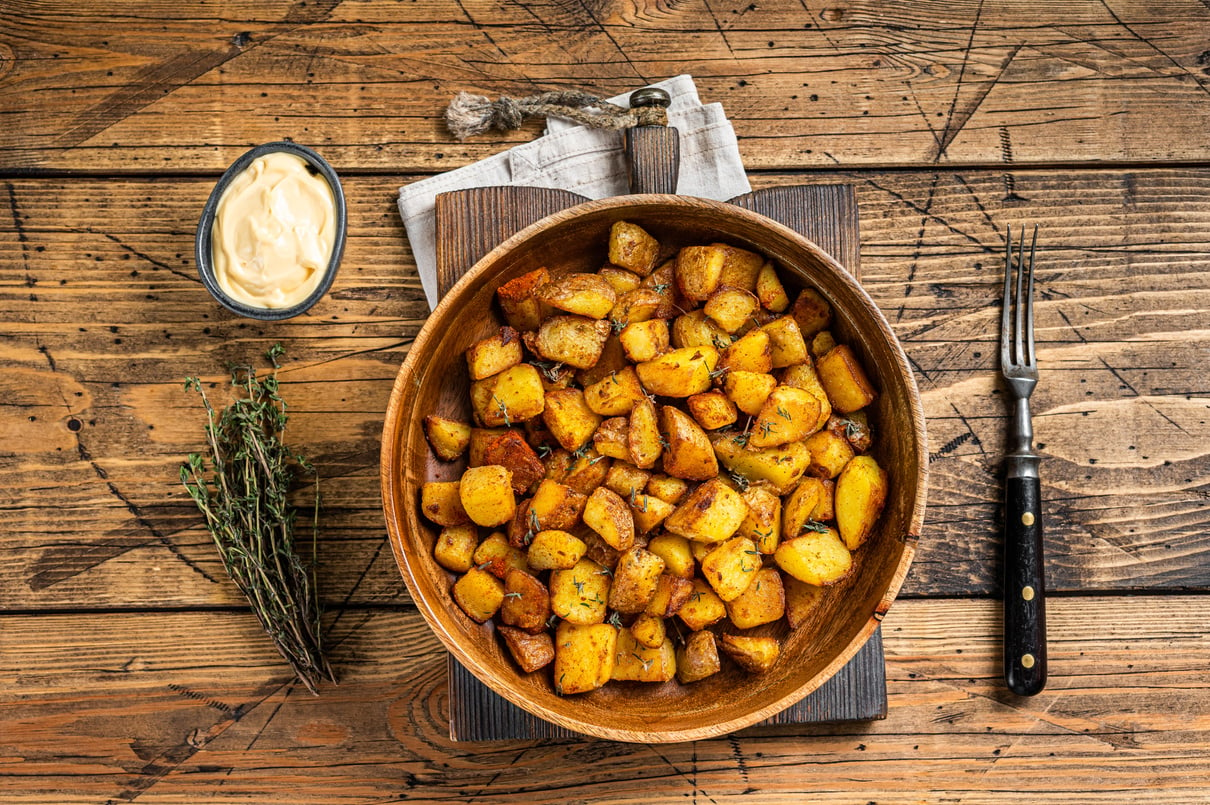 Fried Potato - Patatas Bravas Traditional Spanish Potatoes Snack Tapas. Wooden Background. Top View